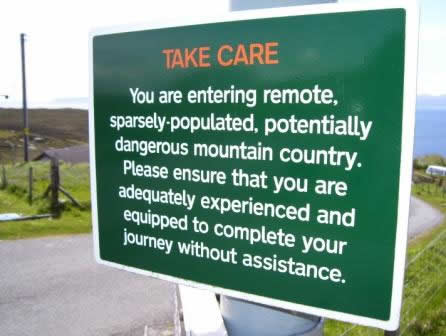 Wilderness warning sign at start of Camasunary path in Elgol